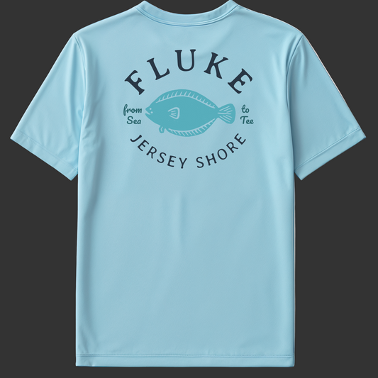 Light blue t-shirt with 'Fluke Jersey Shore' text and fish graphic on a gray background