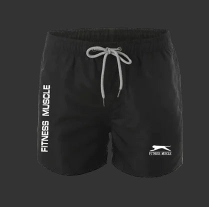 Black shorts with 'Fitness Muscle' branding on a light gray background