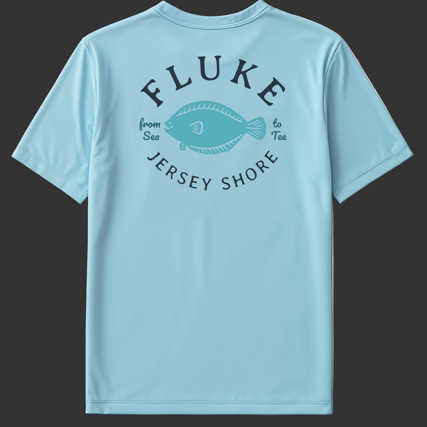 Light blue t-shirt with 'Fluke Jersey Shore' text and fish graphic on a gray background