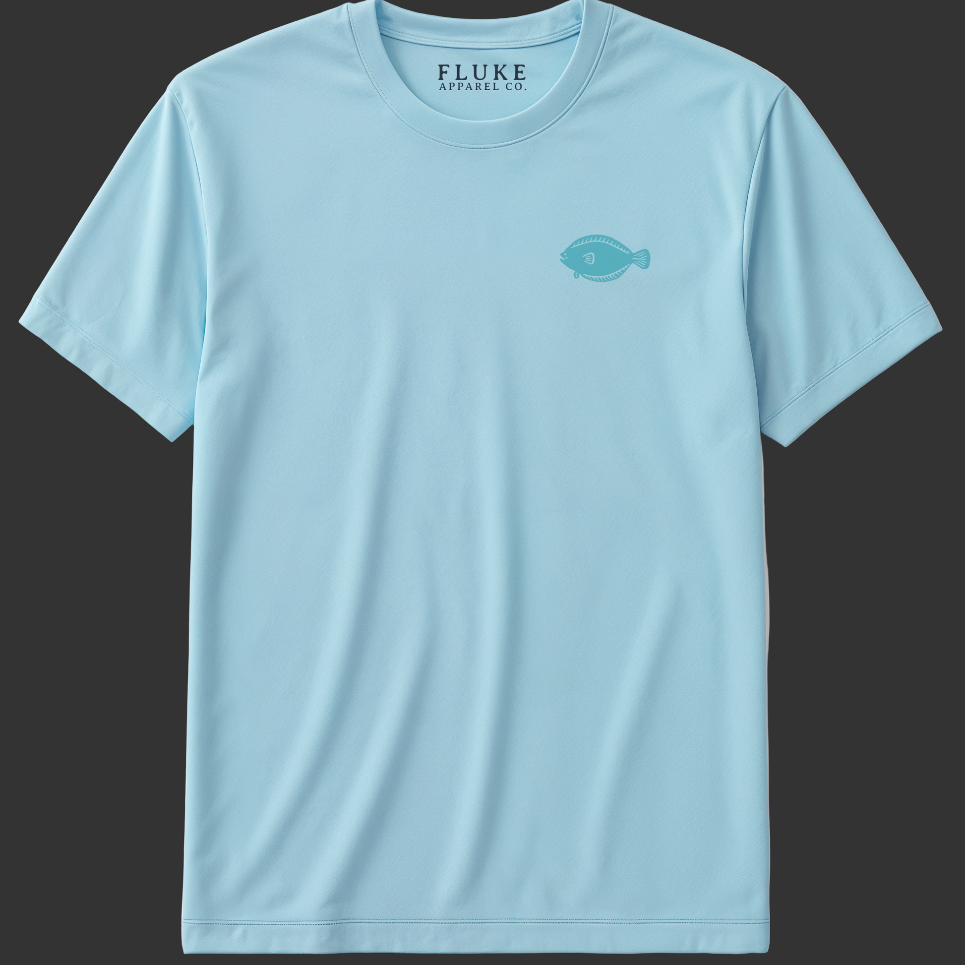 Light blue t-shirt with a small logo on a gray background (frontofshirt)