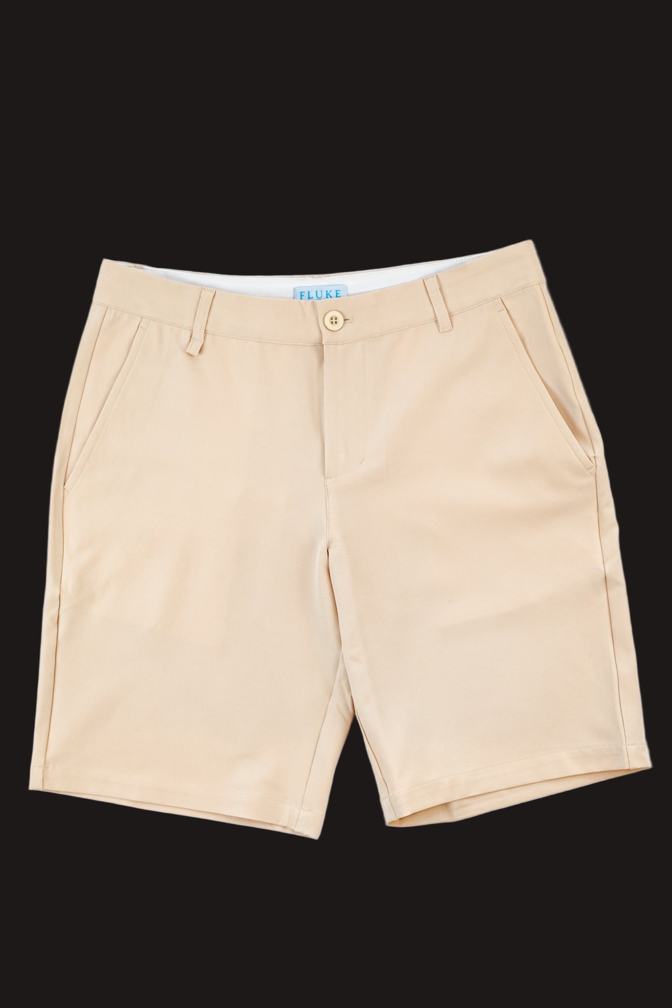 Beige shorts on a black background