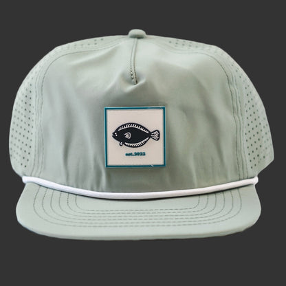 Light green cap with a fish logo patch on a Dark Blue background
