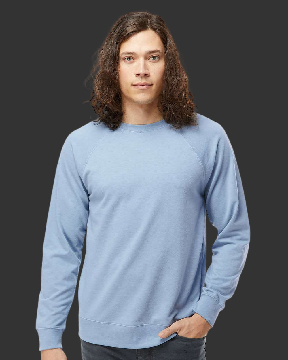 Person wearing a light blue sweatshirt against a plain background