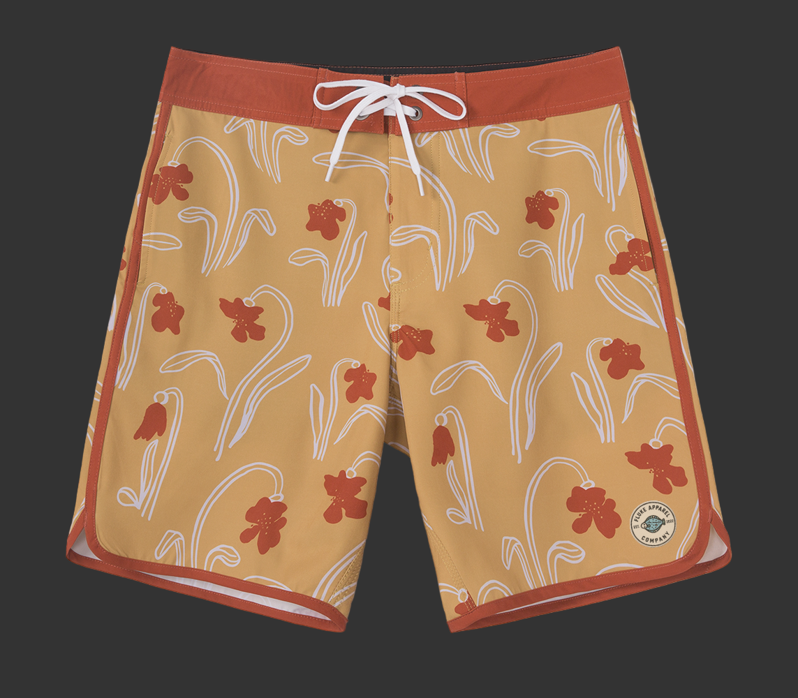 Floral patterned shorts with a red border on a gray background