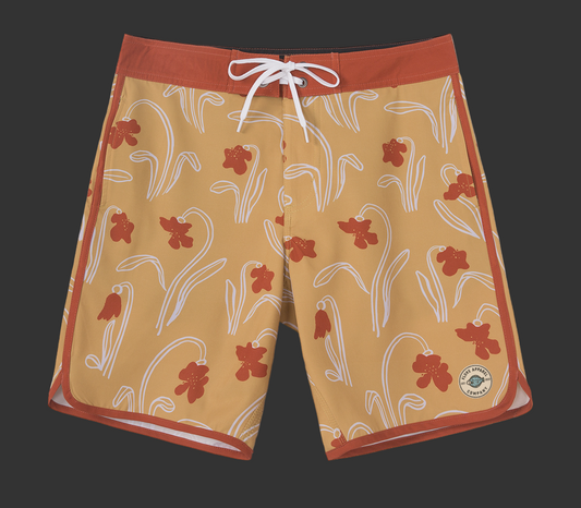 Floral patterned shorts with a red border on a gray background