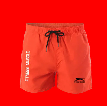 Orange shorts with a logo and text on a gray background
